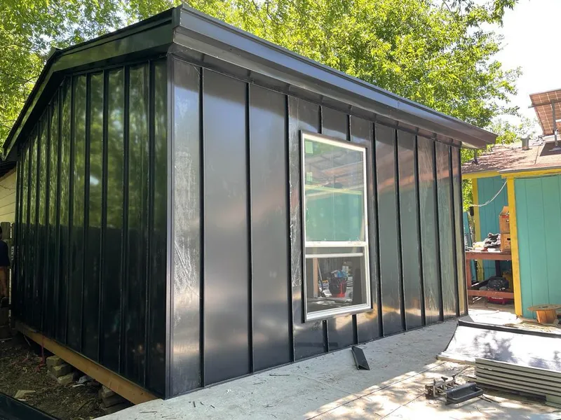 Black standing seam metal wall panels for Metal Roof Installation in Pflugerville